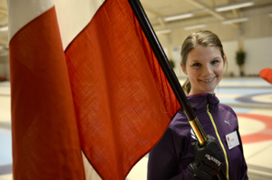 Lene Nielsen, the Danish curling team captain, was selected to carry Dannebrog in the opening ceremonies at the 2014 Winter Olympics in Russia. (Photo courtesy of Lars Moller and Lars Schram for DIF and Team Danmark)