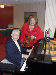 The John Stone Duo entertained at The Danish Home of Chicago on Tuesday, December 23, 2014. (Photo courtesy of The Danish Pioneer Newspaper)