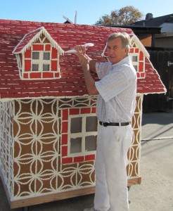 Danish baker Bent Olsen presents one of his unique gingerbread houses in Solvang, CA. (File Photo: Olsen's Danish Village Bakery)